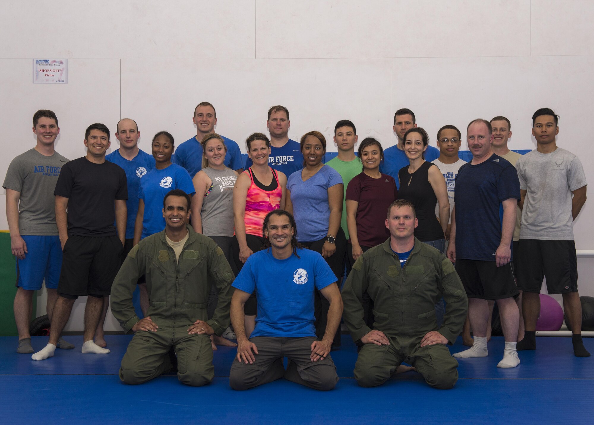 Airmen assigned to the 459th Airlift Squadron, along with Michael Johnson, master combatives instructor, pose for a group photo during a team-building combative training, May 12, 2017, at Yokota Air Base, Japan. During the training, Airmen received instruction on how to efficiently defend themselves in hand-to-hand combat in confined quarters as well as an introduction on basic knife handling techniques. (U.S. Air Force photo by Airman 1st Class Juan Torres)