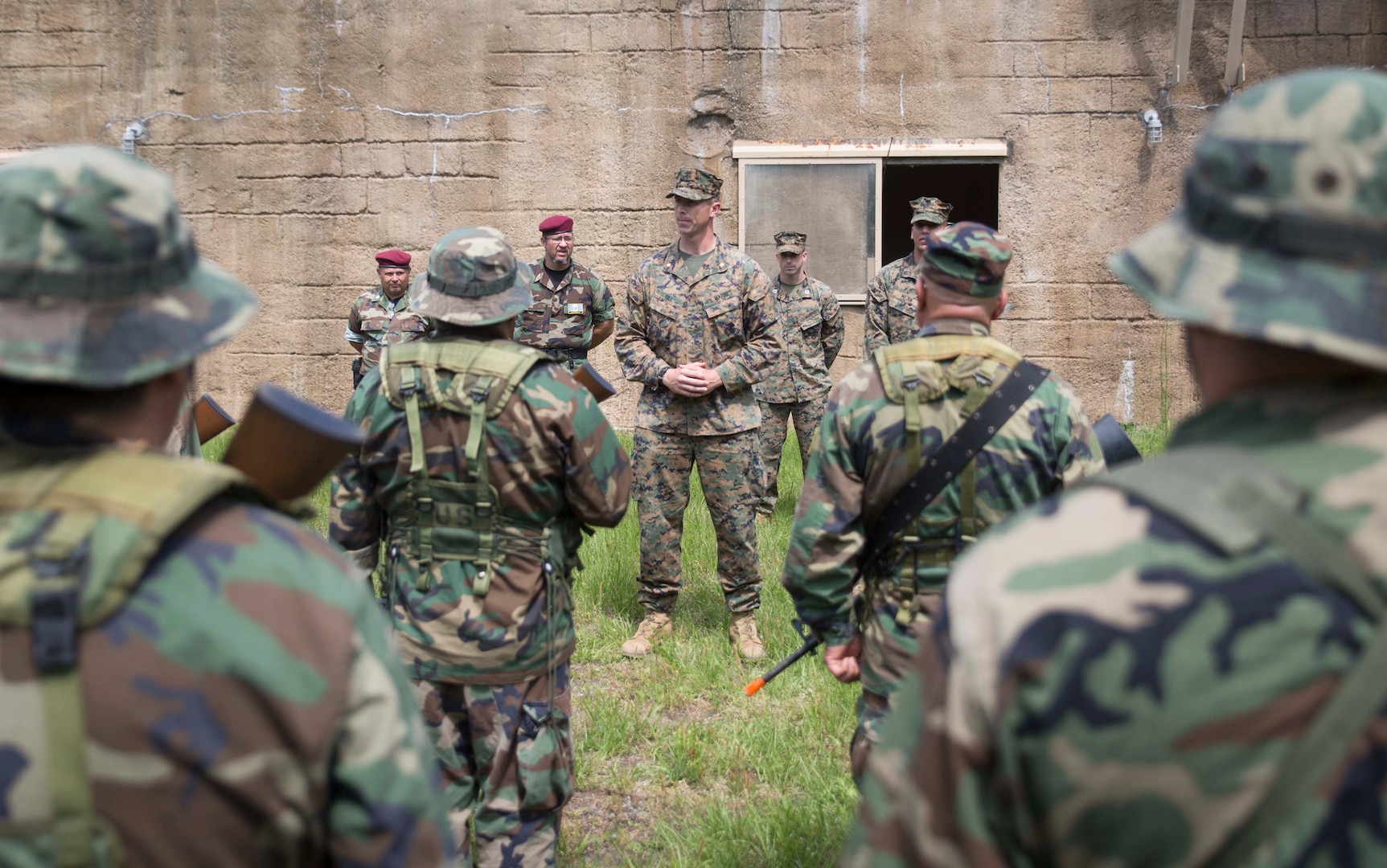 CAMP LEJEUNE, N.C. – Maj. Robert G. Gill speaks to role players at a simulated graduation ceremony during General Exercise 2 at Marine Corps Base Camp Lejeune, North Carolina, May 4, 2017. The Marines conducted the final rehearsal exercise of the Marine Advisor Course in order to assess their readiness to train foreign security forces during their upcoming deployment to Central America. Gill is the officer in charge of the Ground Combat Element, Special Purpose Marine Air-Ground Task Force - Southern Command. The Marine Advisor Course is taught by the Marine Corps Security Cooperation Group. (U.S. Marine Corps photo by Sgt. Ian Leones)