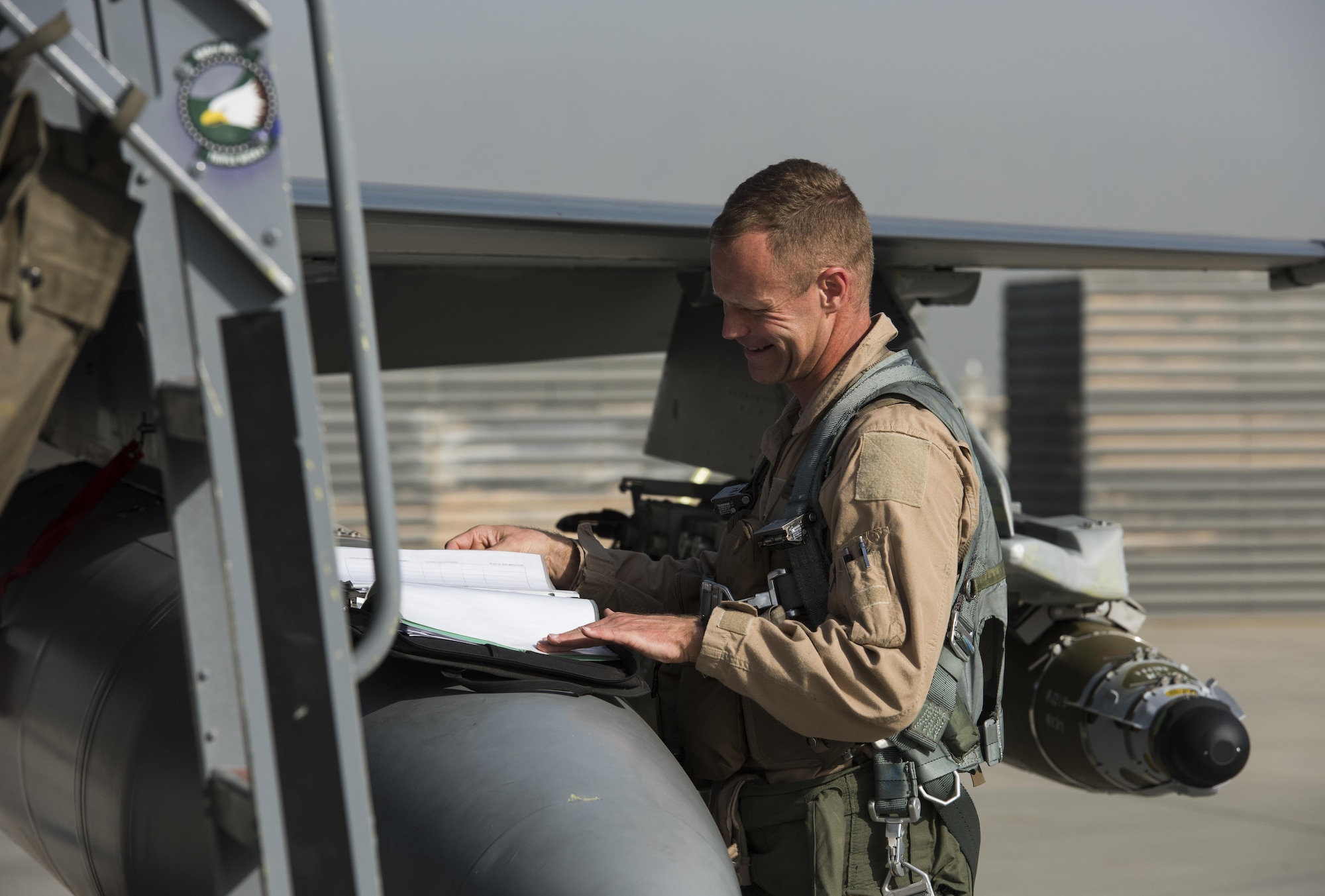 Brig. Gen. Jim Sears, commander of the 455th Air Expeditionary Wing, conducts pre-flight checks prior to his fini flight at Bagram Airfield, Afghanistan, May 22, 2017. The fini flight is a time-honored military aviation tradition marking the last flight of a commander's tour. (U.S. Air Force photo by Staff Sgt. Benjamin Gonsier)