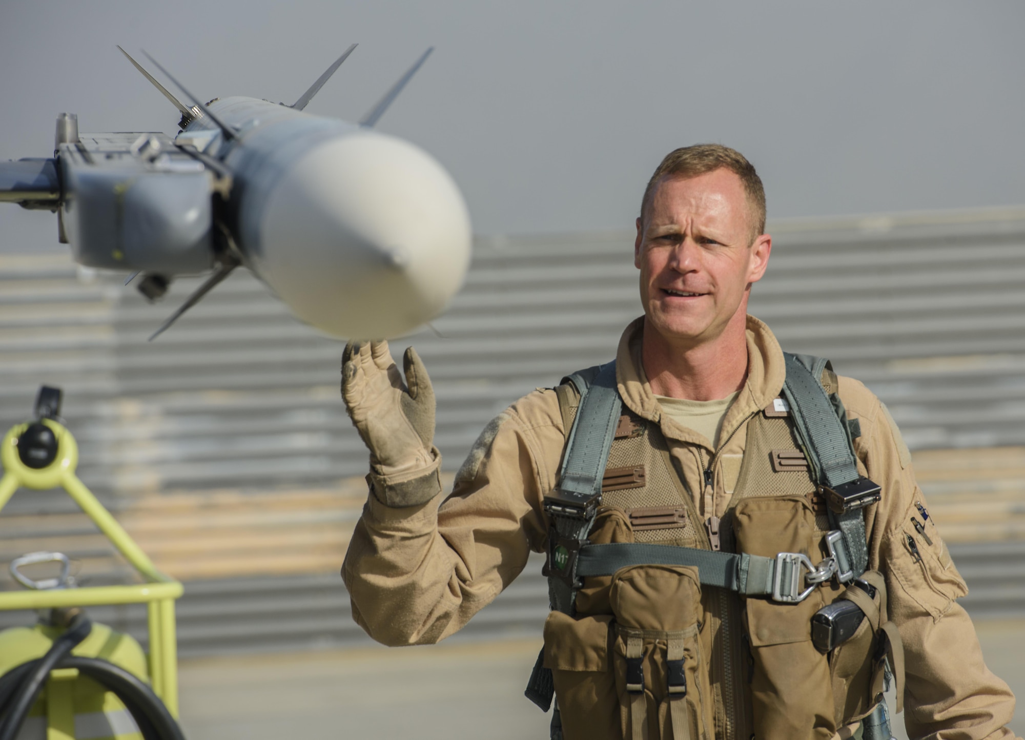 Brig. Gen. Jim Sears, commander of the 455th Air Expeditionary Wing, conducts pre-flight checks prior to his fini flight at Bagram Airfield, Afghanistan, May 22, 2017. During the flight, Sears patrolled the skies with his wingman, engaging enemy ground forces from above to support coalition and Afghan troops. (U.S. Air Force photo by Staff Sgt. Benjamin Gonsier)