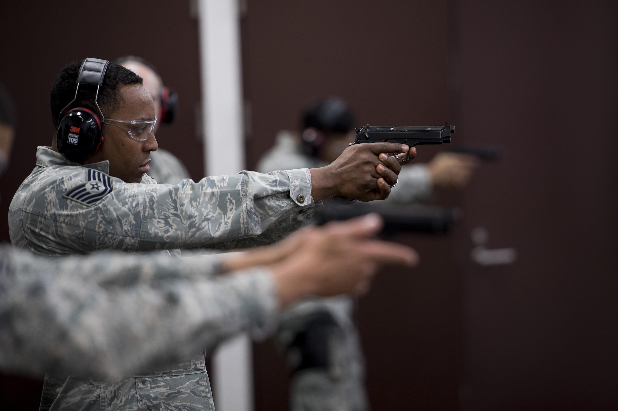 A 374th Security Forces Squadron member participates in a Police Week shooting competition, May 16, 2017, at Yokota Air Base, Japan. The winner of the competition was decided based on points earned depending on where each shot hit a target at 15 meters. (U.S. Air Force photo by Airman 1st Class Donald Hudson)