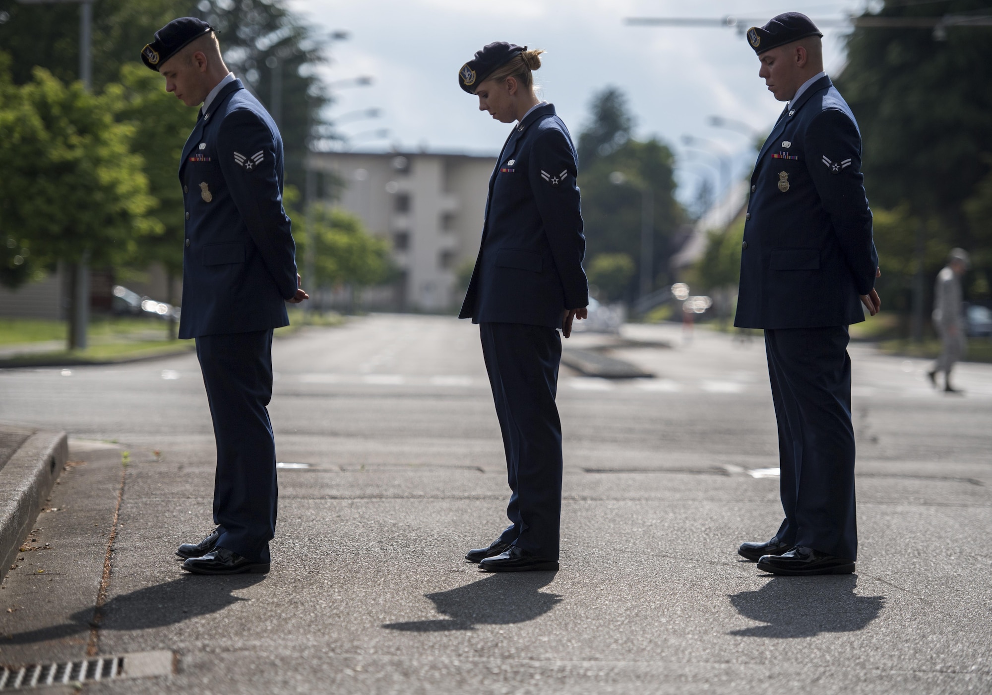 374th Security Forces Squadron members bow their heads in prayer during a memorial retreat ceremony for fallen law enforcement members, May 18, 2017, at Yokota Air Base, Japan. The ceremonial lowering and folding of the flag was done by members of the 374 SFS who are also part of Yokota’s Honor Guard. (U.S. Air Force photo by Airman 1st Class Donald Hudson) 