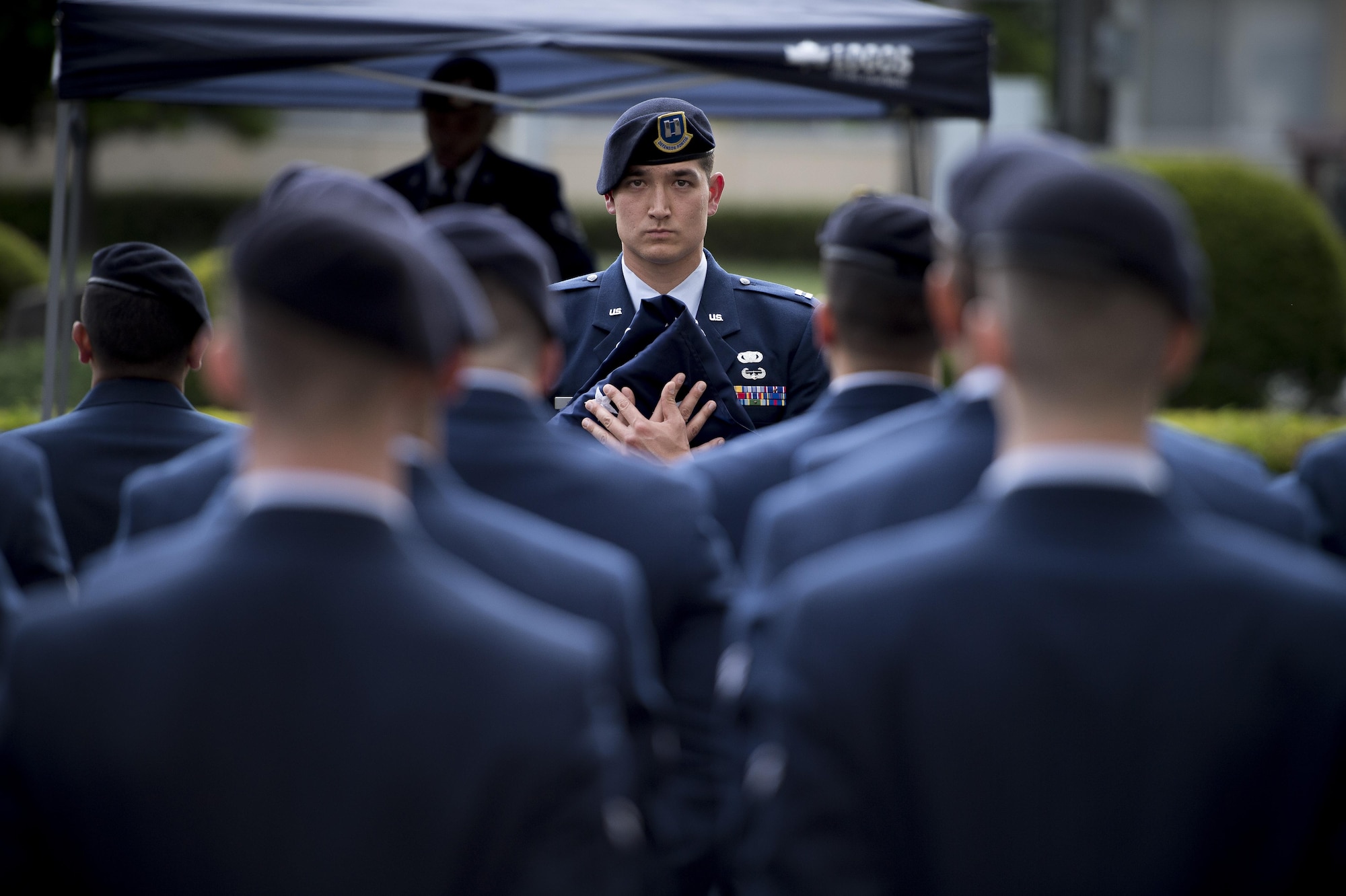 Capt. Michael F. Winter, 374th Security Forces Squadron commander, holds the ceremonial flag during a memorial retreat ceremony for fallen law enforcement members, May 18, 2017, at Yokota Air Base, Japan. During this ceremony the flag represented all the flags that were given to the families of the fallen U.S. Security Forces members, and that this one belongs to their Security Forces brothers and sisters. (U.S. Air Force photo by Airman 1st Class Donald Hudson)