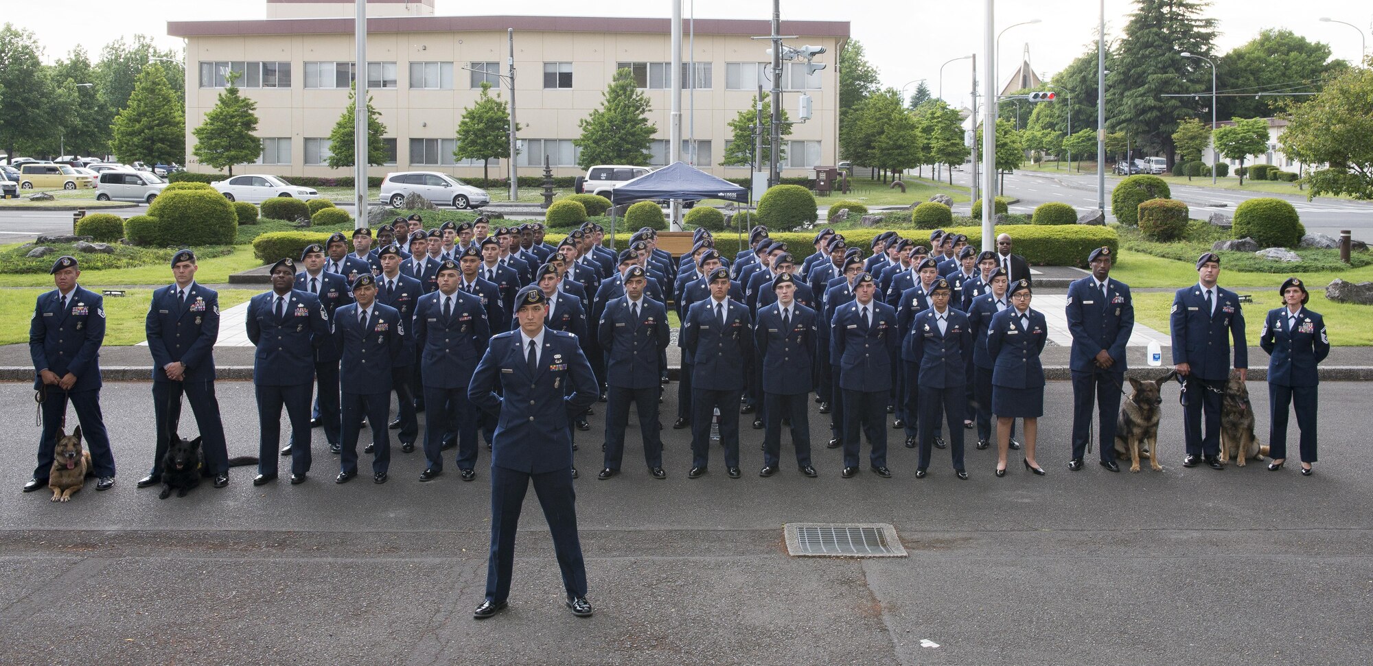 Airmen assigned to the 374th Security Forces Squadron pose for group photo after a memorial retreat ceremony for fallen law enforcement members, May 18, 2017, at Yokota Air Base, Japan. The memorial service included a ceremony recalling the names of U.S. Air Force Security Forces members who died in the line of duty since Operation Enduring Freedom. (U.S. Air Force photo by Airman 1st Class Donald Hudson)
