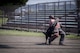 A 374th Security Forces Squadron K-9 unit takes down a handler acting as a decoy suspect during a Police Week K-9 Unit tactical obstacle course competition, May 19, 2017, at Yokota Air Base, Japan. The K-9 Unit tactical obstacle course consisted of barriers, simulated wounded, low-crawl, decoy suspect takedown and clearing a vehicle of suspects. (U.S. Air Force photo by Airman 1st Class Donald Hudson)