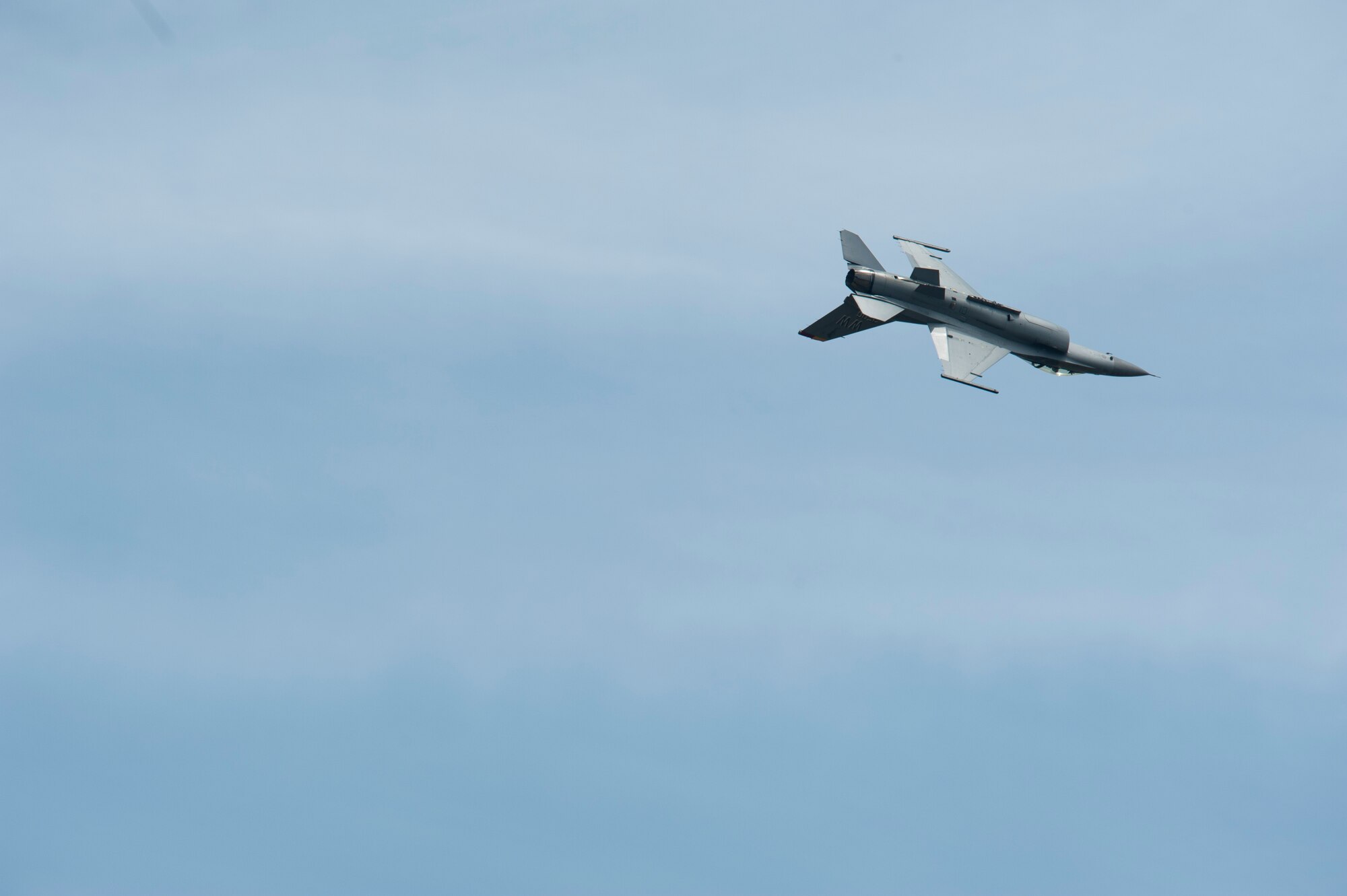 U.S. Air Force Maj. Richard Smeeding, the Pacific Air Forces F-16 Demonstration Team pilot, performs the triple aileron roll during the Hofu Air Festival at Hofu-kita Air Base, Japan, May 21, 2017. The triple aileron roll was one of 14 maneuvers Smeeding completed during the 15-minute display of the F-16 Fighting Falcon’s capabilities. (U.S. Air Force photo by Staff Sgt. Melanie Hutto)