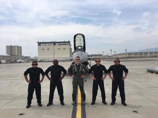 Members of the U.S. Pacific Air Forces F-16 Demonstration Team pause for a photo prior to launching from Marine Corps Air Station Iwakuni, Japan, to the Hofu Air Festival, May 21, 2017. Due to the runway being too short for the F-16 Fighting Falcon to take-off and land, the show was staged, meaning the jet launched from a different location than where the air show took place. The PACAF F-16 Demonstration Team is comprised of members from 13th Fighter Squadron, 14th FS and 35th Aircraft Maintenance Squadron. The team includes one pilot, two narrators, one safety observer, a superintendent and a maintenance team composed of three crew chiefs and four specialists, responsible for the aircraft's avionics and electrical systems and engines. (Courtesy photo)