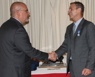 VIRGINIA BEACH, Va.  (May 18, 2017) - Bobby Starks is awarded the Navy Superior Civilian Service Medal by John Fiore, Naval Surface Warfare Center Dahlgren Division Technical Director. Starks retired after more than 34 years as a Navy civilian.

