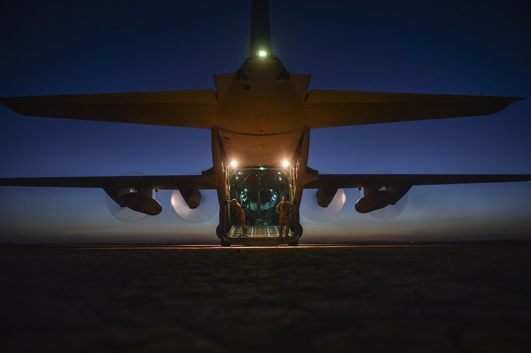 U.S. Air National Guard Airmen with the 127th Airlift Wing inspect a C-130H Hercules following a dry lake bed landing during Exercise Eager Lion May 17, 2017, in Jordan. Eager Lion 2017, an annual U.S. Central Command exercise in Jordan designed to strengthen military-to-military relationships between the U.S., Jordan and other international partners. This year's iteration is comprised of about 7,200 military personnel from more than 20 nations that will respond to scenarios involving border security, command and control, cyber defense and battlespace management. (U.S. Air Force photo by Senior Airman Ryan Conroy)