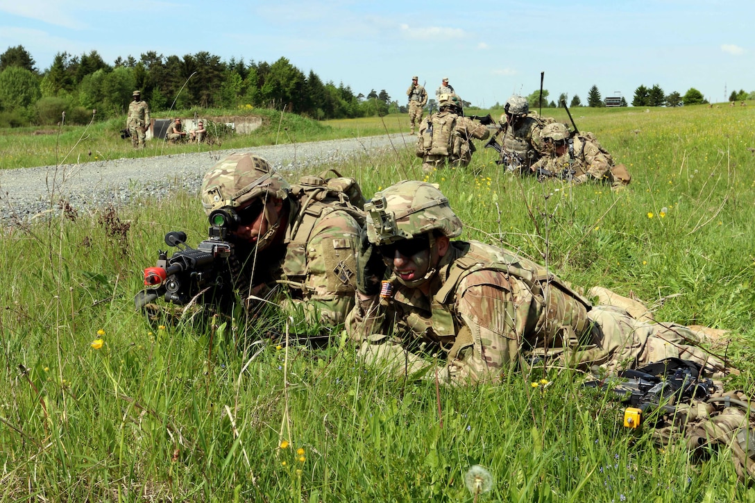 Soldiers provide perimeter security while team members participate in medical evacuation training in Grafenwoehr, Germany, May 22, 2017. Army photo by Staff Sgt. Kathleen V. Polanco