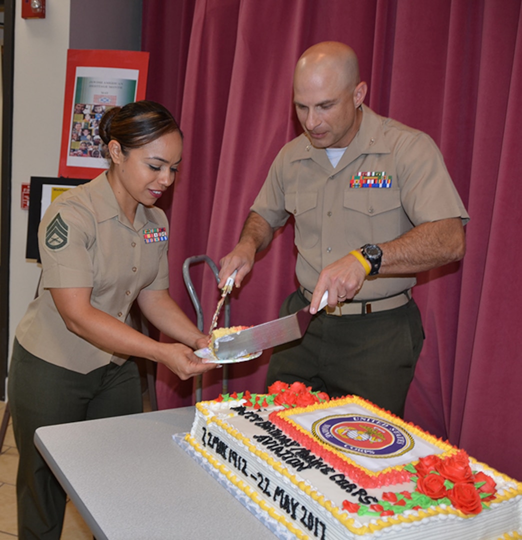 Marine Corps Col. A. J. Manuel, Defense Logistics Agency Aviation Marine Corps logistics lead, serves cake to Marine Corps Staff Sgt. Elizabeth Najieb, a V-22 weapon system customer account specialist, Marine Division, Customer Operations Directorate, DLA Aviation, during the DLA Aviation Marine Corps’ 105th aviation birthday celebration held May 22, 2017 in the Center Restaurant on Defense Supply Center Richmond, Virginia.  The cake was made by Juan Delvalle, a retired food service Marine instructor from Fort Lee, Virginia’s Marine Corps Detachment Food Service School.