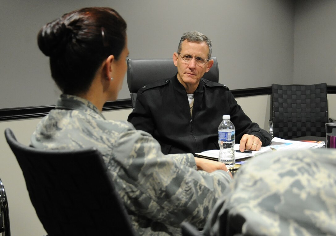 Rear Adm. David A. Lane (right), National Capital Region (NCR) Medical Directorate director, Defense Health Agency, listens to Col. Leslie A. Knight , 779th Medical Group commander, during his visit May 24, 2017 at Joint Base Andrews, Md. During the meeting, the director discussed his vision regarding how Malcolm Grow Medical Clinics and Surgery Center fit into the NCR construct, how the National Defense Authorization Act will affect the region's medical services, and how he can support the 779th Medical Group. (U.S. Air Force photo by Staff Sgt. Joe Yanik)