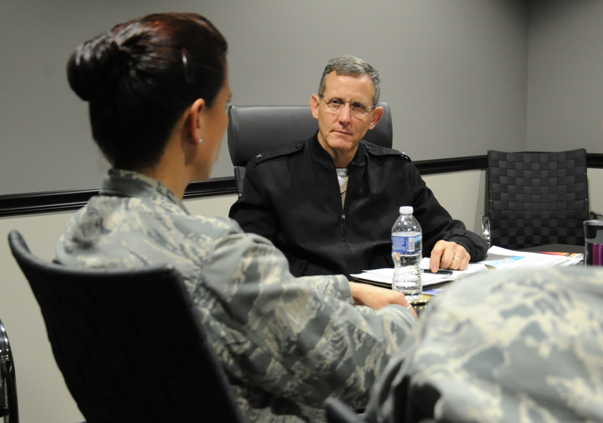 Rear Adm. David A. Lane (right), National Capital Region (NCR) Medical Directorate director, Defense Health Agency, listens to Col. Leslie A. Knight , 779th Medical Group commander, during his visit May 24, 2017 at Joint Base Andrews, Md. During the meeting, the director discussed his vision regarding how Malcolm Grow Medical Clinics and Surgery Center fit into the NCR construct, how the National Defense Authorization Act will affect the region's medical services, and how he can support the 779th Medical Group. (U.S. Air Force photo by Staff Sgt. Joe Yanik)