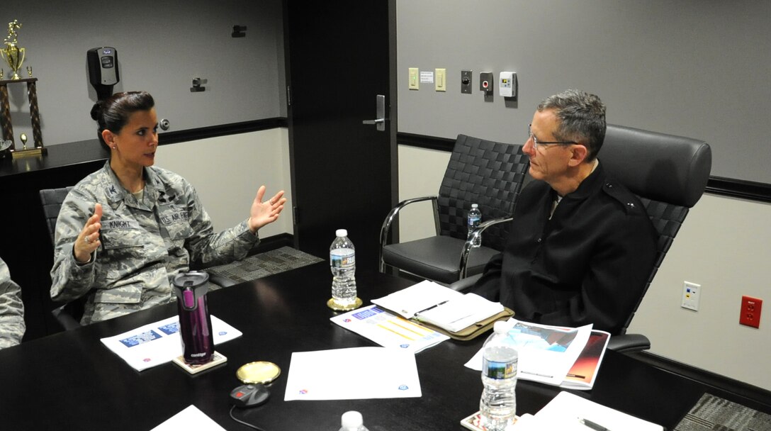 Rear Adm. David A. Lane (right), National Capital Region (NCR) Medical Directorate director, Defense Health Agency, listens to Col. Leslie A. Knight , 779th Medical Group commander, during his visit May 24, 2017 at Joint Base Andrews, Md. During the meeting, the director shared and took questions about his vision regarding how Malcolm Grow Medical Clinics and Surgery Center fit into the NCR construct and how the National Defense Authorization Act will affect the region's medical services. (U.S. Air Force photo by Staff Sgt. Joe Yanik)