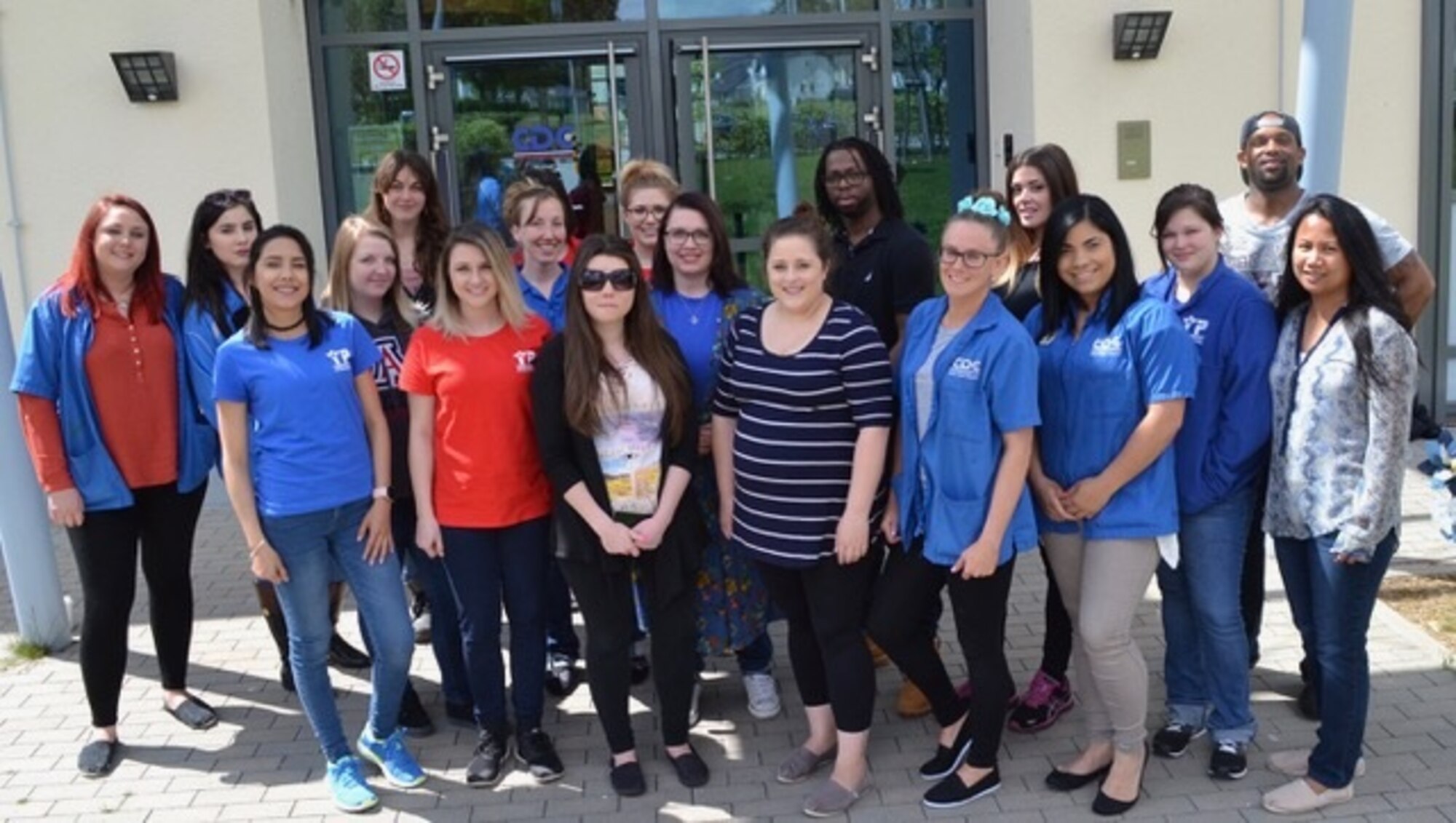 :  A group of Spangdahlem child care providers from the base child development center, school age program, and teen and tween centers stand together May 12 in front of the CDC at Spangdahlem Air Base, Germany.  The providers met to celebrate National Provider Appreciation Day, which is annually on the Friday before Mother’s Day. (U.S. Air Force photo by Tech Sgt. Felicia Blackwell) 