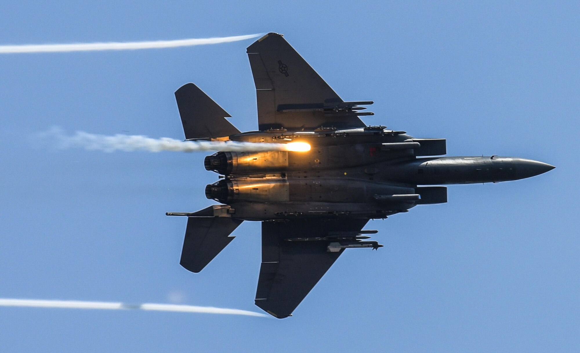An F-15E Strike Eagle releases flares as part of a combined arms demonstration during the Wings Over Wayne Air Show, May 21, 2017, at Seymour Johnson Air Force Base, N.C. The demonstration showcased both the air-to-air and air-to-ground capabilities of the Strike Eagle. (U.S. Air Force photo/Staff Sgt. Brittain Crolley)