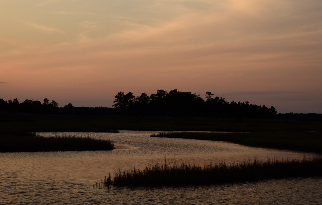 The sun sets over brackish marshes at Joint Base Langley-Eustis, Va., May 10, 2017. Brackish marshes are ideal nesting places to Diamondback Terrapin Turtles, which is a declining species. (U.S. Air Force photo by Staff Sgt. Natasha Stannard)