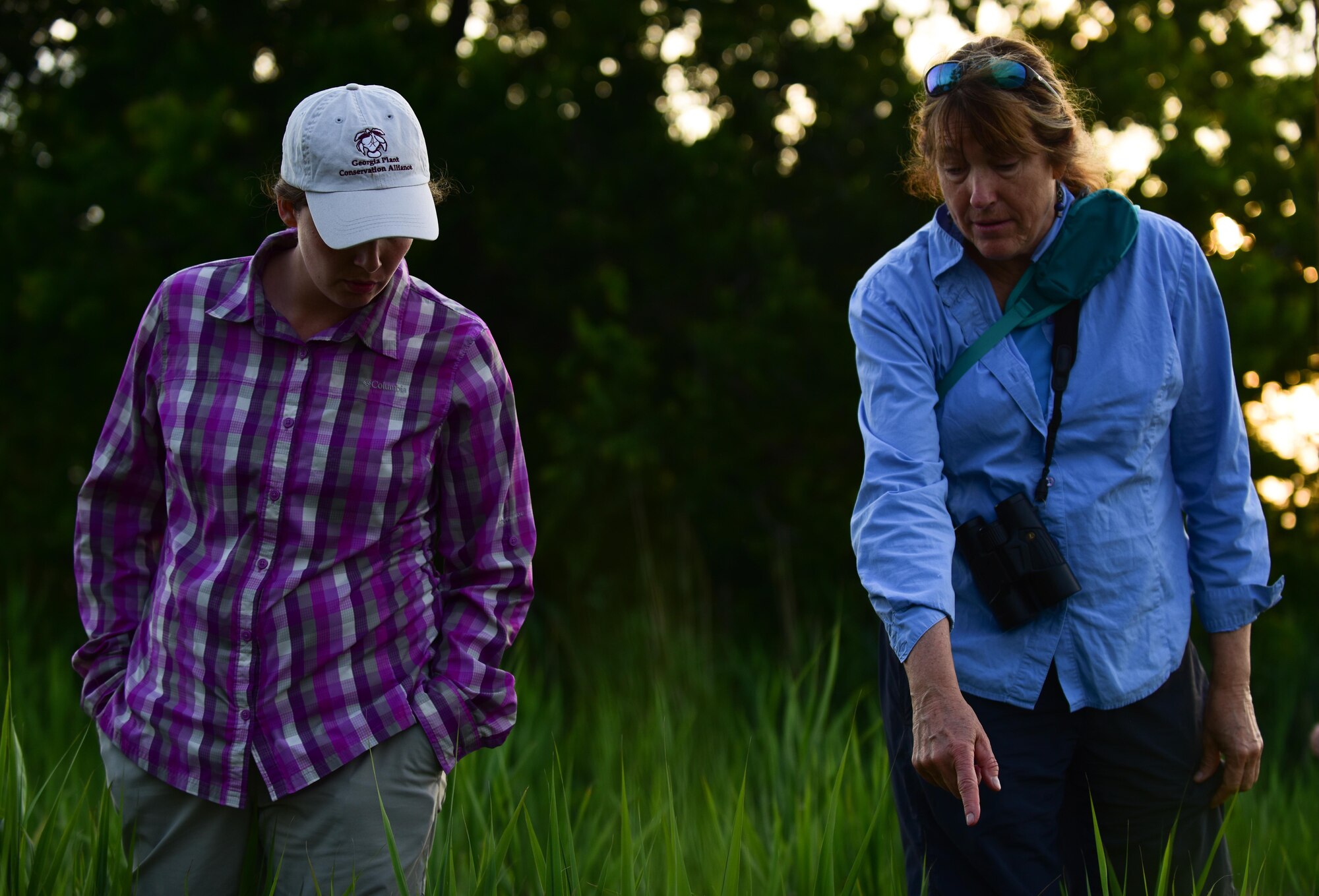 Karen Terwilliger, a local environmental expert, points out an ideal Diamondback Terrapin Turtle nesting place to Alicia Garcia, Colorado State University natural resource program manager for Langley AFB, at a brackish water marsh at Joint Base Langley-Eustis, Va., May 10, 2017. Langley Air Force Base’s shoreline, 3,000 linear feet of which was restored, is an ideal nesting place for the Diamonback Terrapin. (U.S. Air Force photo by Staff Sgt. Natasha Stannard)