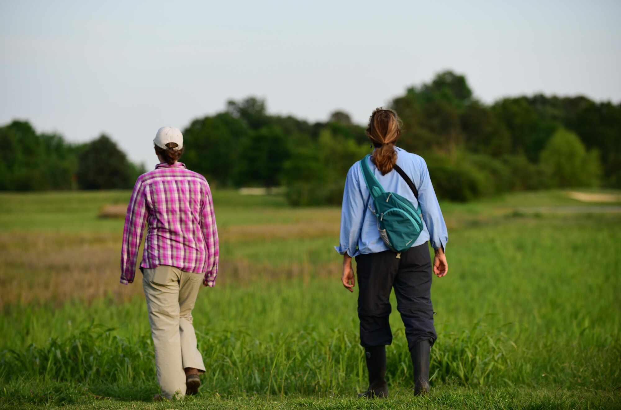 Alicia Garcia, Colorado State University natural resource program manager for Langley AFB, and Karen Terwilliger, a local environmental expert, walk out to marshes at Joint Base Langley-Eustis, Va., May 10, 2017. JBLE environmental teams work with local wildlife experts to not only cover more ground in searching for threatened or endangered species, but to determine preservation practices that won’t inhibit military missions. (U.S. Air Force photo by Staff Sgt. Natasha Stannard)
