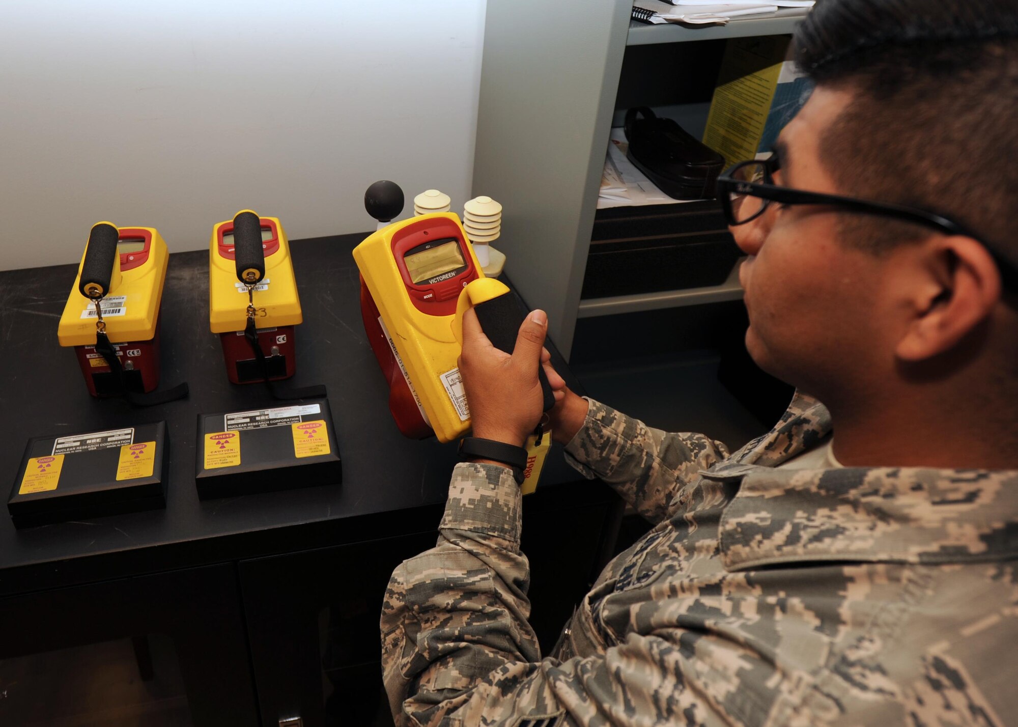 Senior Airman Velentine Orta-Bartolon, 19th Aerospace Medicine Squadron Bioenvironmental technician, calibrates a device May 18, 2017, at Little Rock Air Force Base, Ark. The equipment is calibrated by using radiation sources to detect contamination.  (U.S. Air Force photo by Airman 1st Class Grace Nichols)