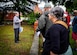 (Left) Carol King, Hampton master tree steward, discusses tree species and land usage history during the Hampton Clean City Commission’s Spring Tree Tour at Joint Base Langley-Eustis, Va., May 13, 2017. This site was home to the Sherwood Plantation in the 1800’s, and although the base acquired the land, the family graves have been cared for as a part of routine base infrastructure management. The Deodar Cedar, one of the trees on the tour, now provides shade to the graveyard at its base. (U.S. Air Force photo/Alicia Garcia)