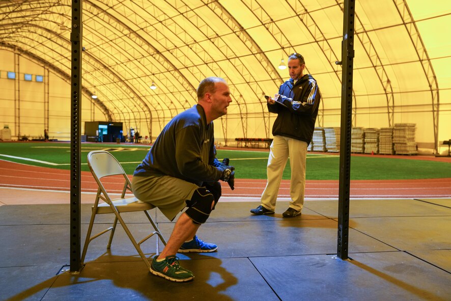 Korey Kuykendall, 3rd Space Operations Squadron, completes body squats during the Murph event at Schriever Air Force Base, Colorado, Friday, May 19, 2017. Kuykendall finished eighth in the male category with a time of 53:16.  (U.S. Air Force photo/Christopher DeWitt)