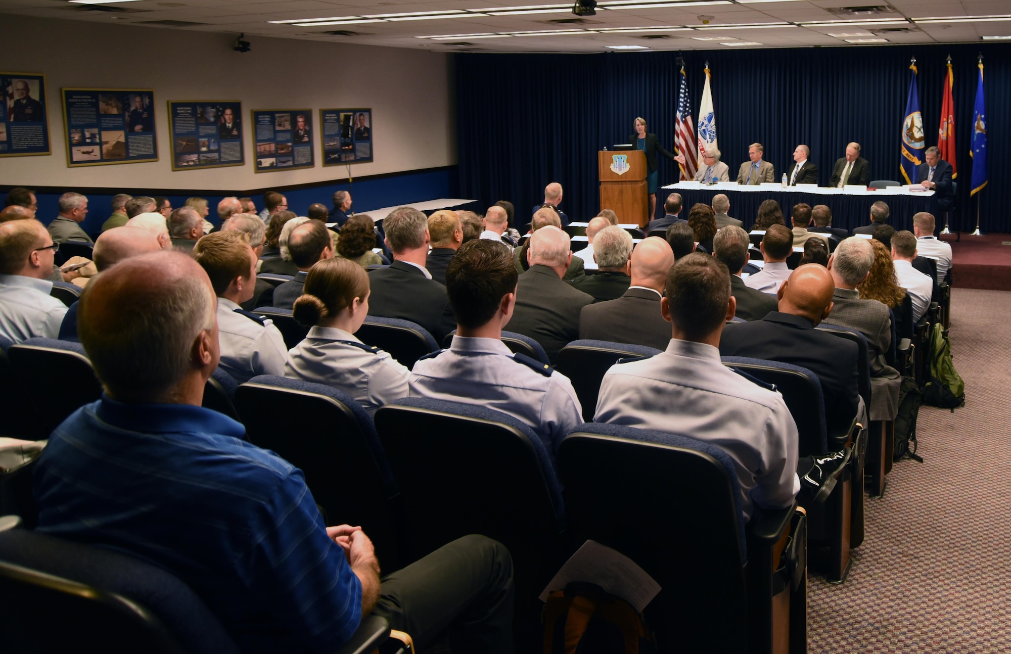 Former directors of the Department of Defense Space Test Program speak to the annual science and technology review conference at Kirtland Air Force Base, May 17. The panel of former directors fielded questions from the audience about a range of different topics.