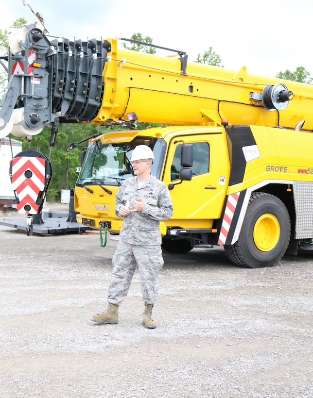 Col. Raymond Briggs, chief of the Arnold Air Force Base Test Systems Sustainment branch, makes remarks at the May 18 acceptance and naming ceremony for the new crane, a Grove GMK5200-1 Hydraulic All Terrain Mobile Crane, purchased to perform routine maintenance of the test facilities at Arnold. The crane was named Windy (pronounced wīn-dē), after retired crane supervisor Windy Cunningham. Briggs mentioned after holding a naming contest for two weeks and receiving 110 entries, a committee determined that Windy was the best fit in honor of Cunningham, who trained several crane operators during his time at Arnold. Cunningham retired from his position after 40 years of service. (U.S. Air Force photo/Deidre Ortiz)