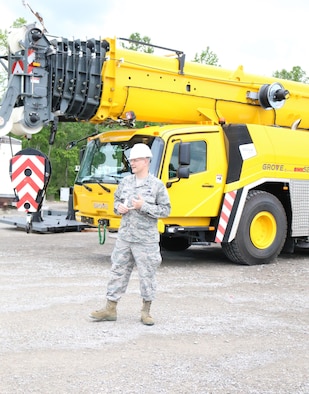 Col. Raymond Briggs, chief of the Arnold Air Force Base Test Systems Sustainment branch, makes remarks at the May 18 acceptance and naming ceremony for the new crane, a Grove GMK5200-1 Hydraulic All Terrain Mobile Crane, purchased to perform routine maintenance of the test facilities at Arnold. The crane was named Windy (pronounced wīn-dē), after retired crane supervisor Windy Cunningham. Briggs mentioned after holding a naming contest for two weeks and receiving 110 entries, a committee determined that Windy was the best fit in honor of Cunningham, who trained several crane operators during his time at Arnold. Cunningham retired from his position after 40 years of service. (U.S. Air Force photo/Deidre Ortiz)