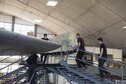 DAYTON, Ohio -- Restoration crews from the National Museum of the U.S. Air Force install the final wing-tip on the Boeing B-17F Memphis Belle™ on March 22, 2017. The famed B-17F Memphis Belle™ and its crew became iconic symbols of the heavy bomber crews and support personnel who helped defeat Nazi Germany. The Memphis Belle was the first US Army Air Forces heavy bomber to return to the US after completing 25 combat missions over Europe. The USAAF chose the Memphis Belle for a highly-publicized war bond tour from June-August 1943, and its crew was celebrated as national heroes. The aircraft and crew were also the subject of two widely-seen Hollywood movies (one in 1944 and another in 1990). The Memphis Belle will be placed on public display at the museum on May 17, 2018. (U.S. Air Force photo by Ken LaRock)