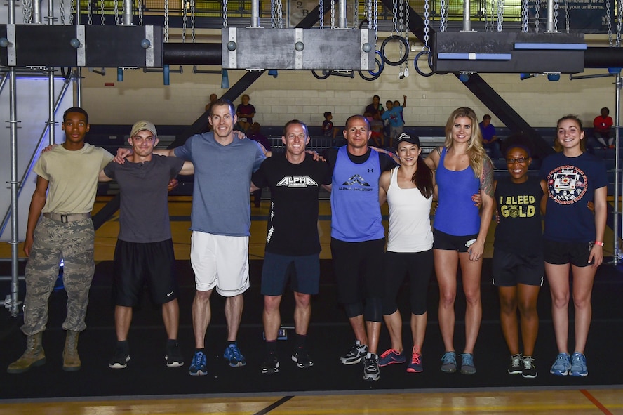 The Alpha Warriors gather and congratulate the three males and females with the best time on the obstacle course at Joint Base Langley-Eustis, Va. May 20, 2017. The individuals who made it the farthest and with the fastest times where placed in the top three. (U.S. Air Force photo/Airman 1st Class Tristan Biese)