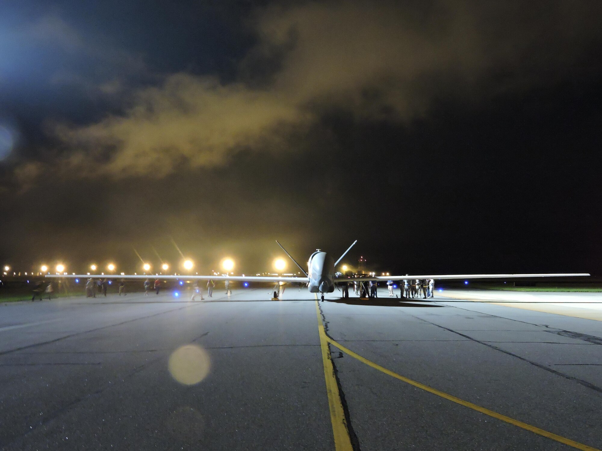 An RQ-4 Global Hawk makes an early morning arrival at Robins AFB, Ga. May 24, 2017. Its arrival marked the first time a Global Hawk has flown into an air logistics complex. (U.S. Air Force photo by Roland Leach)