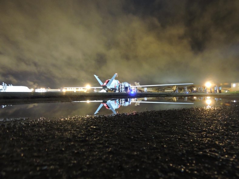 An RQ-4 Global Hawk makes an early morning arrival at Robins AFB, Ga. May 24, 2017. Its arrival marked the first time a Global Hawk has flown into an air logistics complex. (U.S. Air Force photo by Roland Leach)