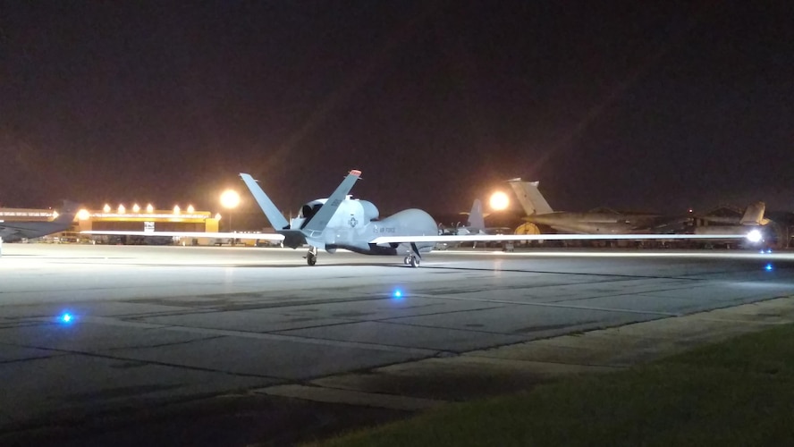 An RQ-4 Global Hawk makes an early morning arrival at Robins AFB, Ga. May 24, 2017. Its arrival marked the first time a Global Hawk has flown into an air logistics complex. (U.S. Air Force photo by Roland Leach)