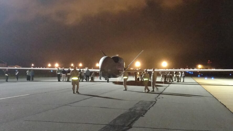 An RQ-4 Global Hawk makes an early morning arrival at Robins AFB, Ga. May 24, 2017. Its arrival marked the first time a Global Hawk has flown into an air logistics complex. (U.S. Air Force photo by Roland Leach)
