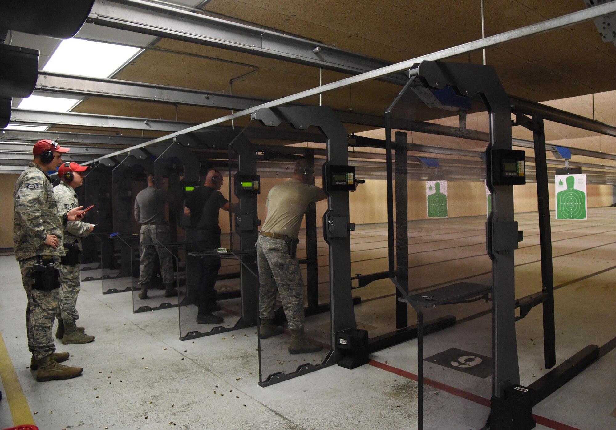 Members of the 81st Security Forces Squadron host the 81st SFS law enforcement team competition shoot in the indoor firing range May 17, 2017, on Keesler Air Force Base, Miss. The event was held during National Police Week, which recognizes the service of law enforcement men and women who put their lives at risk every day. (U.S. Air Force photo by Kemberly Groue)