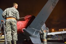 In the early morning hours of May 24, an RQ-4 Global Hawk landed at Robins Air Force Base. Aircraft routinely fly to Robins but this was the first one to land without a pilot onboard. To prepare for its arrival a building-based launch and recovery element was established. Robins maintenance professionals will provide an organic paint capability during the aircraft's stay here. (U.S. Air Force photos by Tommie Horton)