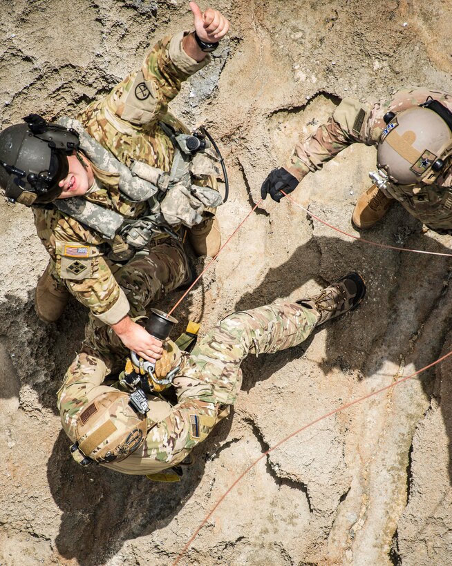 Soldiers rehearse extraction techniques with a jungle penetrator in a disaster response scenario to support Operation Vigilant Guard on St. Croix, Virgin Islands, May 16, 2017. The soldiers are assigned to the West Virginia Army National Guard's 1st Battalion, 150th Aviation Regiment and 2nd Battalion, 19th Special Forces Group. Army photo by Sgt. Lisa M. Sadler
