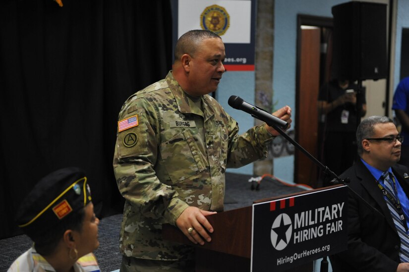 Brig. Gen. Jose R. Burgos, deputy commander of the 99th Regional Support Command, welcomes approximately 300 veterans, service members and military spouses in attendance during Hiring Our Heroes job fair held at the Community Club, on Fort Buchanan, May 18th.
