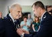 Retired Maj. Joe Campbell is awarded the Distinguished Flying Cross by Col. Ty Neuman, 2nd Bomb Wing commander, during an award ceremony at his residence in Shreveport, La., May 18, 2017. Campbell, a veteran of World War II, the Korean War, and Vietnam, received the award for heroism and extraordinary achievement during aerial operations in the Korean War. (U.S. Air Force photo/Senior Airman Mozer O. Da Cunha)