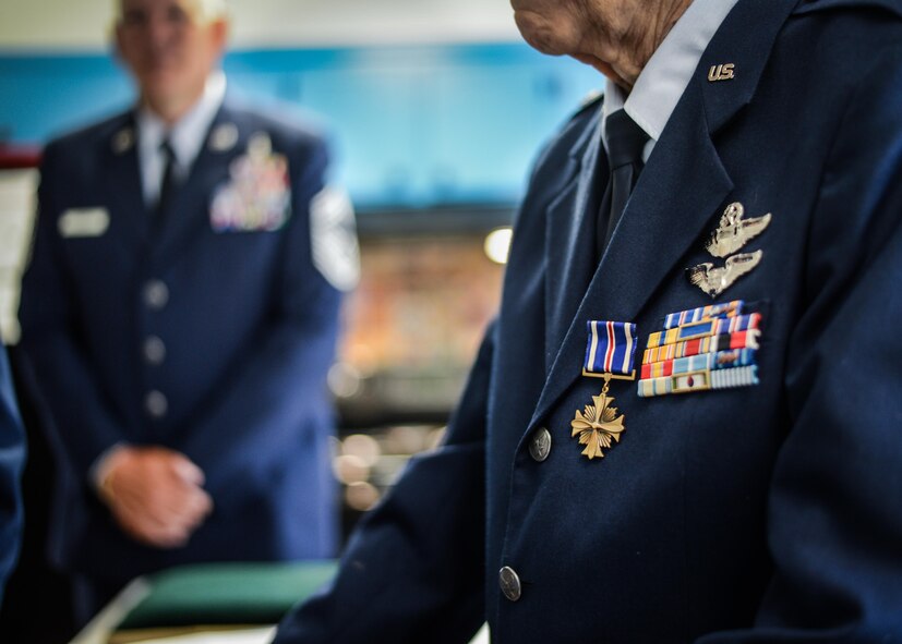 Retired Maj. Joe Campbell speaks to guests after receiving the Distinguished Flying Cross in Shreveport, La., May 18, 2017. Campbell is a veteran of World War II, the Korean War, and Vietnam and is also rated as both a pilot and navigator, as depicted by his wearing two distinct sets of wings. (U.S. Air Force photo/Senior Airman Mozer O. Da Cunha)