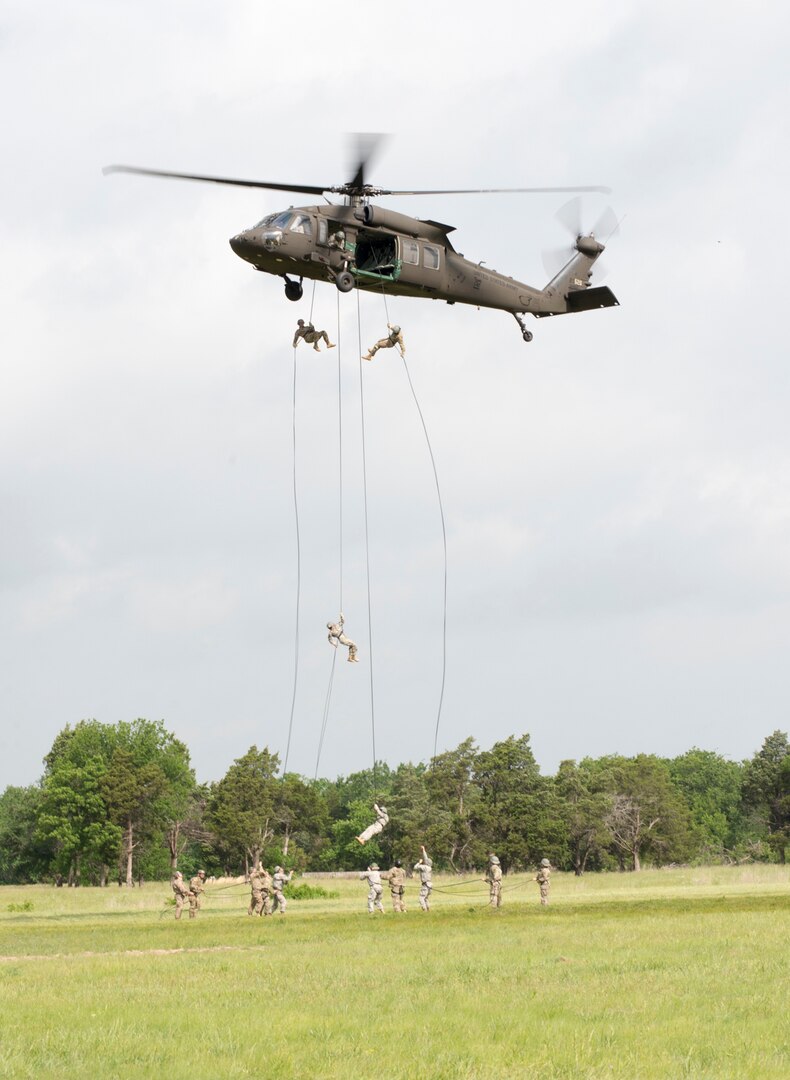 Army and Air National Guardsmen from all over the nation rappel out of UH-60 Black Hawk helicopters on May 18, 2017, one of the culminating events before completing Air Assault school held at the Oklahoma National Guard’s premier training area, Camp Gruber Training Center, near Braggs, Oklahoma. 