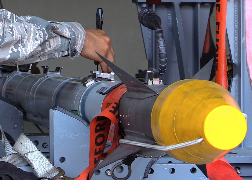 U.S. Air Force Senior Airman Christopher Lewis, 1st Maintenance Group weapons standardization lead crew member, prepares an AIM-9X missile to be loaded onto an F-22 Raptor, at Joint Base Langley-Eustis, Va., April 19, 2017. Compared to the older AIM-9M, the AIM-9X maneuvers easier, picks up heat signatures better and is a safer weapon overall. (U.S. Air Force photo/Airman 1st Class Amanda Dole)