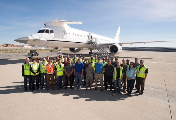 Members of the F-22 Flying Test Bed team pose for a photo in front of the highly modified Boeing 757 May 3, 2017. The FTB routinely flies with real Raptors both at Edwards and Nellis Air Force Base, Nevada, in order to gain an early look at F-22 mission software before the software is released to developmental flight test, mainly at Edwards. The FTB can fly up to 30 crewmembers. (U.S. Air Force photo/Ethan Wagner)