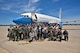 A very wet Maj. Jonathan Lauer, center holding his son, poses with all in attendance to celebrate his fini flight May 22, 207, Scott Air Force Base, Illinois. Lauer was the 932nd Airlift Wing executive officer, and will new work for Air Mobility Command as a senior executive officer.  (U.S. Air Force photo by Christopher Parr)