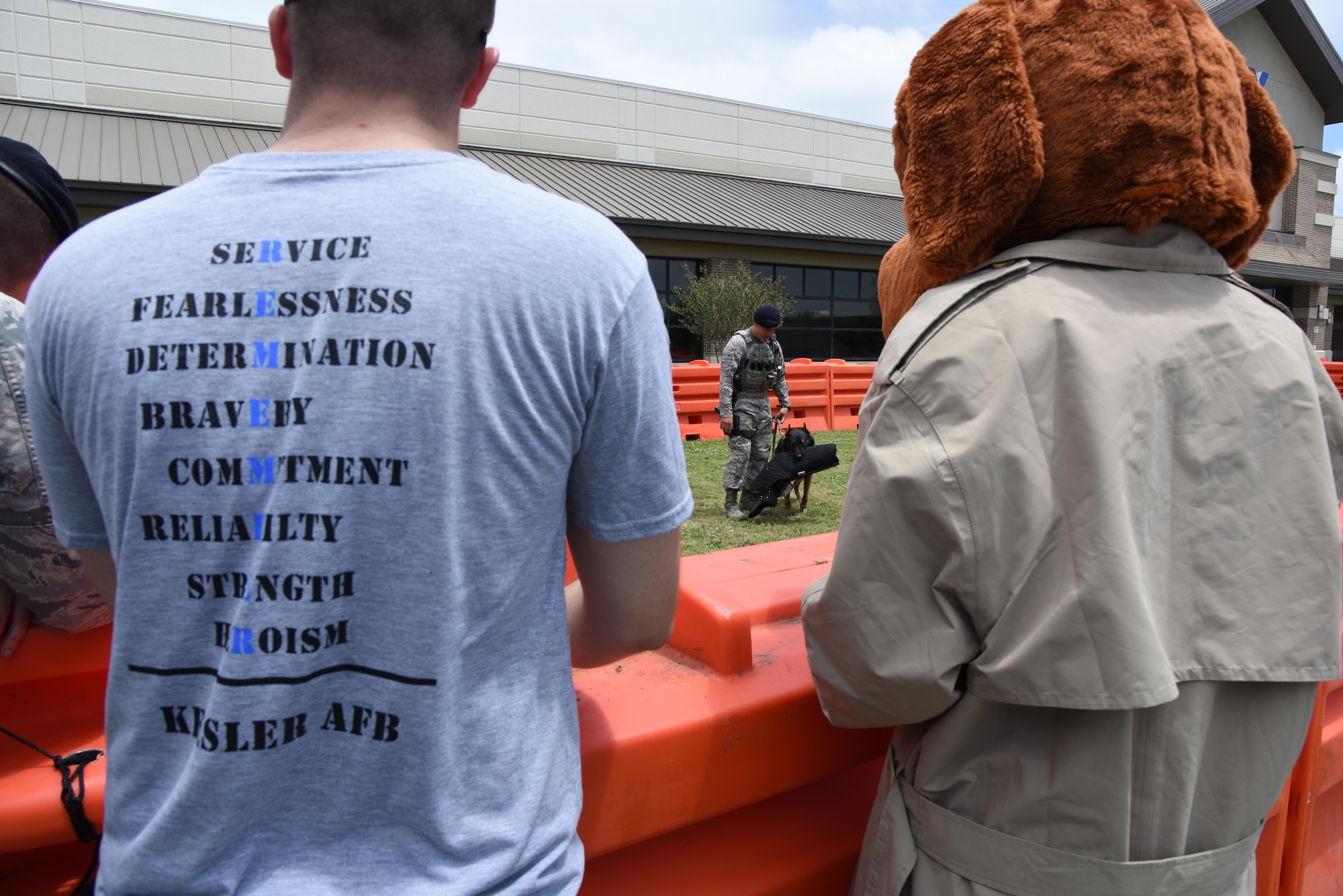 Staff Sgt. Matthew Ratchford, 81st Security Forces Squadron military working dog handler, and Toki, military working dog, provide a demonstration during the 81st SFS Police Week fun day at the Base Exchange May 18, 2017, on Keesler Air Force Base, Miss. The event was held during National Police Week, which recognizes the service of law enforcement men and women who put their lives at risk every day. (U.S. Air Force photo by Kemberly Groue)