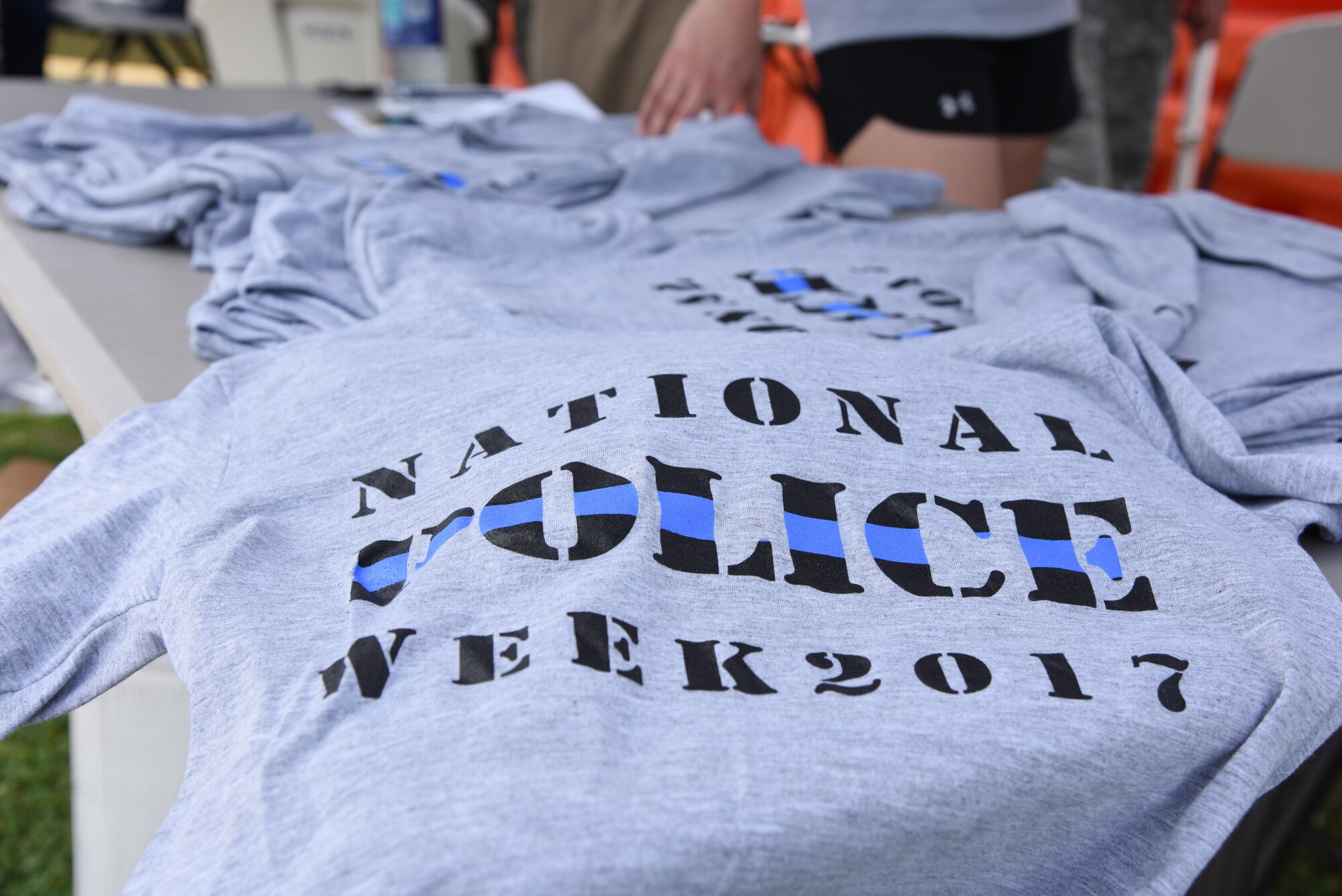 National Police Week t-shirts’ sit on display during the 81st Security Forces Squadron Police Week fun day at the Base Exchange May 18, 2017, on Keesler Air Force Base, Miss. The event was held during National Police Week, which recognizes the service of law enforcement men and women who put their lives at risk every day. (U.S. Air Force photo by Kemberly Groue)