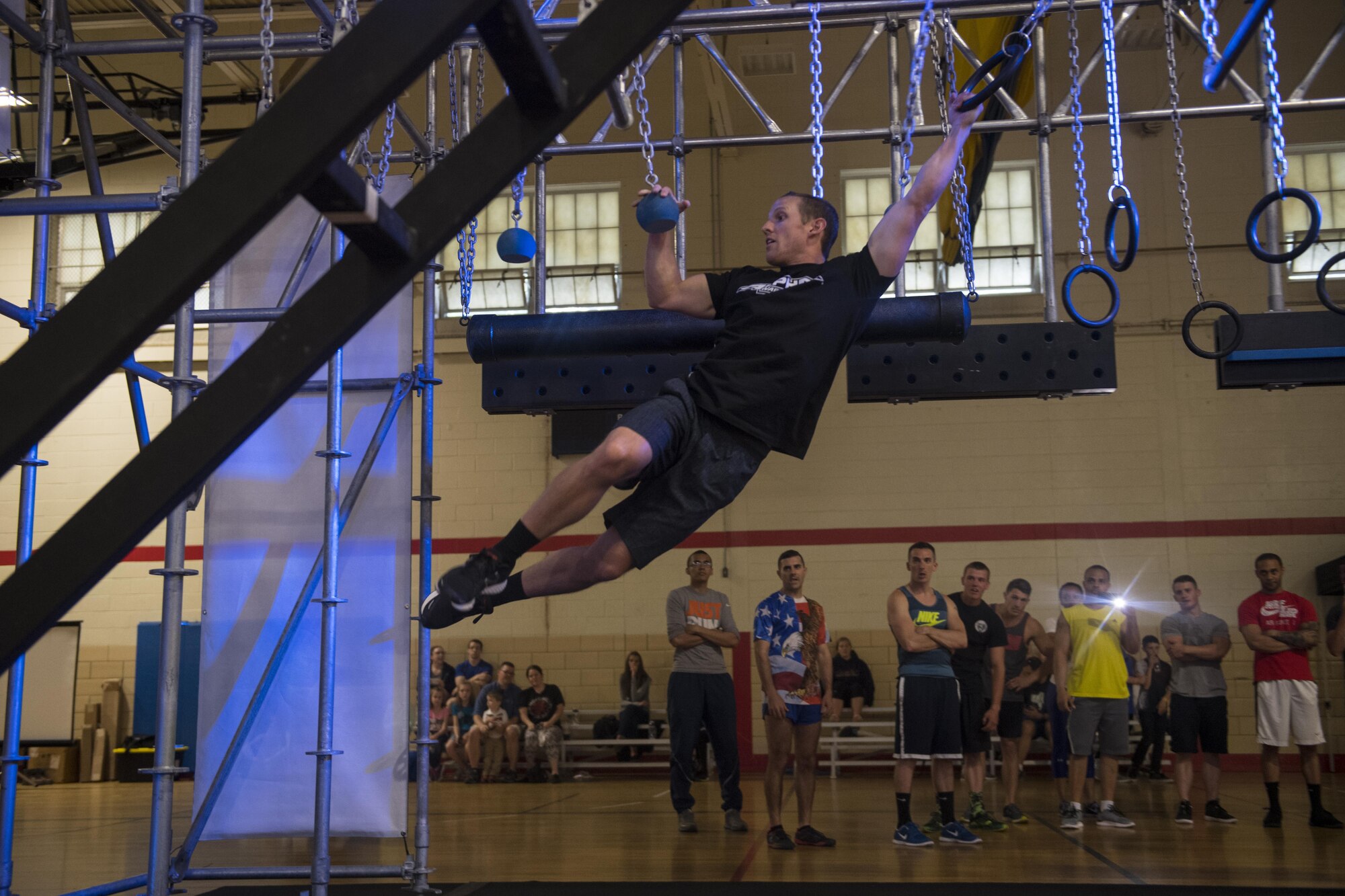 Kevin Klein, Alpha Warrior athlete, demonstrates obstacles  on the Alpha Warrior Battle Rig at Joint Base McGuire-Dix-Lakehurst, N.J. May 23. Alpha Warrior athletes are touring Air Force Bases Promoting Functional Fitness and obstacle training.
