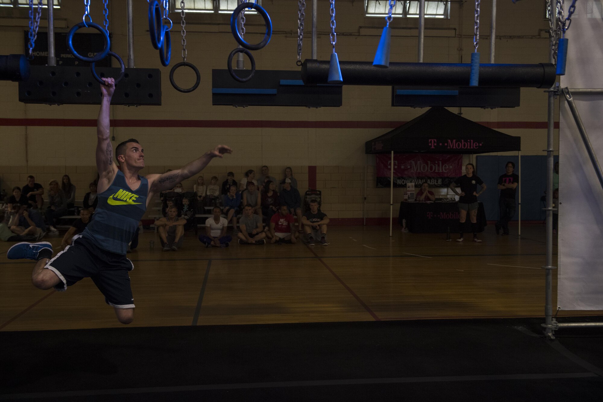 Tech. Sgt. James Mitchell, Financial Management Flight chief, tests his luck on the Alpha Warrior Battle Rig at Joint Base McGuire-Dix-Lakehurst, N.J. May 23. Alpha Warrior athletes are touring Air Force Bases Promoting Functional Fitness and obstacle training.