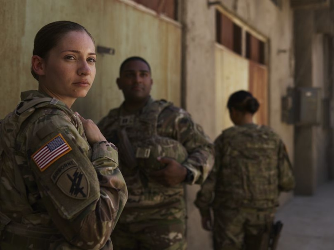 Staff Sgt. Jhenna Broussard takes a moment to relax outdoors with Capt. David Miranda after completing a training exercise.